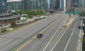 An eastbound vehicles drives on the Gardiner Expressway as the westbound lanes are shut down following a collision involving two dump trucks near Spadina Avenue Tuesday June 11, 2024. 