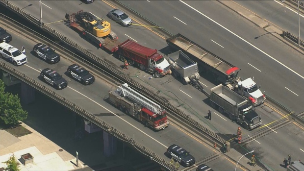 Several trucks involved in a fatal crash on the westbound Gardiner Expressway are shown Tuesday June 11, 2024. (CP24)