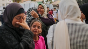 Palestinian women mourn near the bodies of relatives killed in an Israeli airstrike, outside the morgue in Al-Aqsa Martyrs Hospital in Deir al Balah, the Gaza Strip, Monday, June 10, 2024. (Jehad Alshrafi / AP Photo)