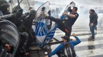 Anti-government protesters clash with police outside Congress, as lawmakers debate a reform bill promoted by Argentine President Javier Milei in Buenos Aires, Argentina, Wednesday, June 12, 2024. (Gustavo Garello / AP Photo)