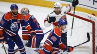 Florida Panthers' Sam Bennett (9) celebrates his goal as Edmonton Oilers' Darnell Nurse (25), Philip Broberg (86) and goalie Stuart Skinner (74) look on during the second period of Game 3 of the NHL hockey Stanley Cup final in Edmonton, Thursday, June 13, 2024.THE CANADIAN PRESS/Jeff McIntosh