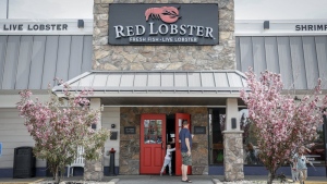 A family leaves a Red Lobster location in Calgary on May 28, 2024. THE CANADIAN PRESS/Jeff McIntosh