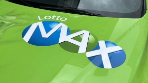 The Lotto Max logo is displayed on a vehicle in downtown Toronto. (Joshua Freeman /CP24)