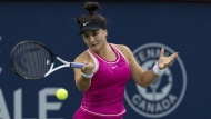 Bianca Andreescu of Canada, hits a return to Camila Giorgi of Italy, during the National Bank Open tennis tournament in Montreal, Tuesday, August 8, 2023. THE CANADIAN PRESS/Christinne Muschi
