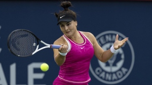 Bianca Andreescu of Canada, hits a return to Camila Giorgi of Italy, during the National Bank Open tennis tournament in Montreal, Tuesday, August 8, 2023. THE CANADIAN PRESS/Christinne Muschi