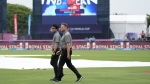 Officials inspect the ground after wet outfield delayed the start of the ICC Men's T20 World Cup cricket match between Canada and India at the Central Broward Regional Park Stadium, Lauderhill, Fla., Saturday, June 15, 2024. THE CANADIAN PRESS/AP-Lynne Sladky