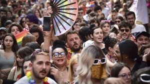 People gather to take part in the Pride parade in Turin, Italy, Saturday, June 15, 2024. (Matteo Secci/Lapresse via AP)