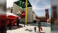 FILE - Emily Robinson and two-year-old Amari Peacock leave the plaza outside the original World of Coca-Cola museum in downtown Atlanta Tuesday, March 2, 1999. The Coca-Cola Co. moved the museum to a different downtown Atlanta site in 2007 and Georgia state government is in the process of demolishing the original building for parking as of Friday, June 14, 2024. (AP Photo/Ric Feld. File)
