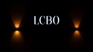 The LCBO logo is illuminated on the wall of a store in Ottawa on March 30, 2021. (The Canadian Press/Adrian Wyld)