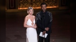 Pre-Show hosts Julianne Hough, left, and Utkarsh Ambudka speaks during the 77th Tony Awards on Sunday, June 16, 2024, in New York. (Photo by Charles Sykes/Invision/AP)