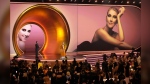 Celine Dion presents the award for album of the year during the 66th annual Grammy Awards on Sunday, Feb. 4, 2024, in Los Angeles. THE CANADIAN PRESS/AP-Chris Pizzello