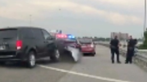 Van slams into police cruiser on highway 