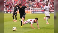 Toronto FC defender Raoul Petretta (bottom right) and Nashville SC midfielder Alex Muyl (19) battle for the ball during the first half of MLS soccer action in Toronto, Wednesday, June 19, 2024. THE CANADIAN PRESS/Mark Blinch