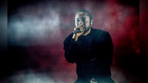 FILE - Kendrick Lamar performs at Coachella Music & Arts Festival at the Empire Polo Club on Sunday, April 16, 2017, in Indio, Calif. Kendrick Lamar turned his Juneteenth “Pop Out” concert into a celebration of Los Angeles unity. The 37-year-old rapper curated a three-hour livestreamed concert featuring a mix of up-and-coming LA rappers and stars including Dr. Dre and Tyler, The Creator. (Photo by Amy Harris/Invision/AP, File)