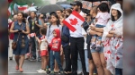 The organizer of Montreal's Canada Day parade has cancelled this year's event. Members of the crowd look on during a Canada Day parade in Montreal, Saturday, July 1, 2023. THE CANADIAN PRESS/Graham Hughes