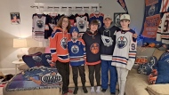 As the Oilers battle the Panthers in Florida on Monday night in Game 7 of the Stanley Cup final series, Canadian fans will shout and scream their support at watch parties in rinks, bars, seniors homes, or even just their living rooms. Oilers fans Coady Morrison, left to right, Tyson DeMone, Melissa Mccallum Derrick DeMone, Jackson DeMone are shown in this handout image. (Derrick DeMone via The Canadian Press)