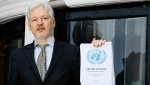 WikiLeaks founder Julian Assange speaks on the balcony of the Ecuadorean Embassy in London, Feb. 5, 2016.  (AP Photo/Kirsty Wigglesworth, File)