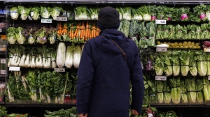 Food inflation ticked higher in Canada in May for the first time in nearly a year. A customer shops in the produce section at a grocery store In Toronto on Friday, Feb. 2, 2024. THE CANADIAN PRESS/Cole Burston
