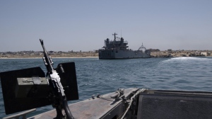 A U.S. Army vessel is seen moored at the U.S.-built floating pier Trident that connects to the beach on the coast of the Gaza Strip, Tuesday, June 25, 2024. (AP Photo/Leo Correa)