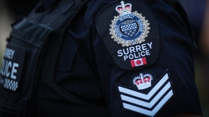 A Surrey police department logo is seen on an officer's uniform in Surrey, B.C., on Wednesday, Aug. 31, 2022. THE CANADIAN PRESS/Darryl Dyck