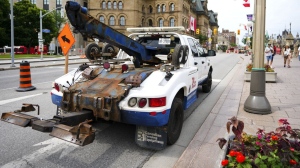 A tow truck is shown in downtown Ottawa on Wednesday, June 29, 2022. THE CANADIAN PRESS/Sean Kilpatrick