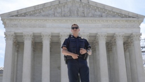 A Capitol Police officer stand guard during a protest outside of the U.S Supreme Court on Thursday, June 20, 2024, in Washington. (AP Photo/Mariam Zuhaib)