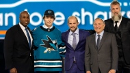 Macklin Celebrini, second from left, poses after being selected by San Jose Sharks during the first round of the NHL hockey draft Friday, June 28, 2024, in Las Vegas. (AP Photo/Steve Marcus) 