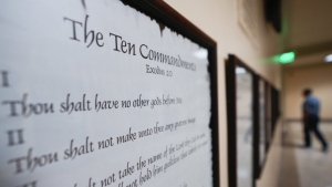 A copy of the Ten Commandments is posted along with other historical documents in a hallway of the Georgia Capitol, Thursday, June 20, 2024, in Atlanta.  (AP Photo/John Bazemore, File)