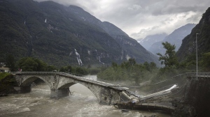 The bridge in Visletteo destroyed due to the storm, in Visletto, in the Maggia Valley, southern Switzerland on Sunday June 30, 2024. (Michael Buholzer/Keystone via AP)