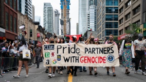 Pro Palestinian protesters disrupt the Toronto Pride Parade, on Sunday, June 30, 2024. (The Canadian Press/Arlyn McAdorey)