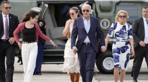 U.S. President Joe Biden, centre right, and first lady Jill Biden, right, arrive on Marine One with granddaughters Natalie Biden, from left, and Finnegan Biden, at East Hampton Airport on June 29, 2024, in East Hampton, N.Y. (Evan Vucci/AP Photo)