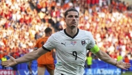 Austria's Marcel Sabitzer celebrates after scoring his side's third goal during a Group D match between the Netherlands and Austria at the Euro 2024 soccer tournament in Berlin, Germany, Tuesday, June 25, 2024. (Michael Kappeler/dpa via AP)