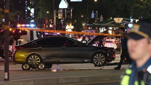 Police officers control a car accident scene near Seoul City Hall in downtown Seoul, South Korea, Monday, July 1, 2024. (Seo Dae-yeon / Yonhap via AP)