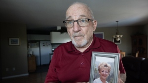 Jean-Luc Duval holds a picture of his late wife, Monique, in his home Friday, June 14, 2024, in Repentigny, Que. .THE CANADIAN PRESS/Ryan Remiorz
