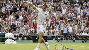 Andy Murray of Britain celebrates after beating Milos Raonic of Canada in the men's singles final on the fourteenth day of the Wimbledon Tennis Championships in London, Sunday, July 10, 2016. (AP Photo/Kirsty Wigglesworth, File)