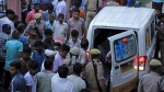 An ambulance arrives at the Sikandrarao hospital in Hathras district. At least 100 are dead after a stampede at a religious gathering of thousands of people in northern India, officials said Tuesday. (Manoj Aligadi/AP Photo)