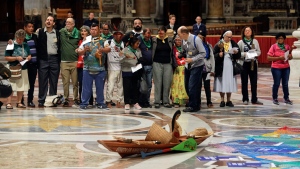 An Amazonian indigenous statue of a pregnant woman is seen as participants in the Amazon synod, attend the opening prayer in St. Peter's Basilica at the Vatican, Monday, Oct. 7, 2019. (Andrew Medichini / AP Photo, File)