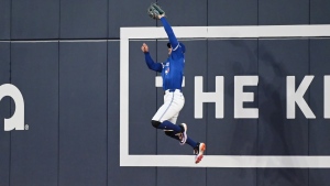 Toronto Blue Jays outfielder George Springer (4) makes a catch on a fly ball by Houston Astros' Joey Loperfido (not shown) during fifth inning MLB baseball action in Toronto on Tuesday, July 2, 2024. THE CANADIAN PRESS/Jon Blacker 