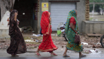 Villagers walk towards the site of Tuesday's stampede in Hathras district, Uttar Pradesh, India, Wednesday, July 3, 2024.  (AP Photo/Rajesh Kumar Singh)