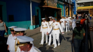 Russian crew members attend a welcoming tour by Venezuelan authorities in La Guaira, Venezuela, after the Almirante Gorshkov frigate and Akademik Pashin oil tanker of the Russian Navy docked there, Tuesday, July 2, 2024. (AP Photo/Ariana Cubillos