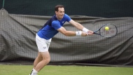 Andy Murray plays a shot during a training session on day two of the 2024 Wimbledon Championships at the All England Lawn Tennis and Croquet Club, London, Tuesday July 2, 2024. (Jordan Pettitt/PA via AP)
