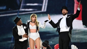 Taylor Swift is joined on stage by Travis Kelce, right, during The Eras Tour at Wembley Stadium on June 23 in London. (Gareth Cattermole/TAS24/Getty Images via CNN Newsource)