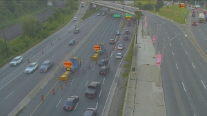 Vehicles are forced off the Gardiner Expressway following a fatal collision near Jameson Avenue Thursday July 4, 2024. 