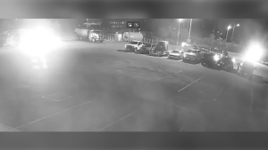 A screengrab of a video showing a suspect setting fire to three dump trucks at an industrial yard in Vaughan. (YPR video)