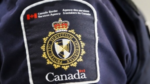 A Canada Border Services Agency patch is seen on an officer in Calgary on Thursday, Aug. 1, 2019. THE CANADIAN PRESS/Jeff McIntosh