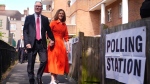 Labour leader Keir Starmer and his wife Victoria arrive to cast their votes in the 2024 General Election at Willingham Close TRA Hall in London, Thursday July 4, 2024. (James Manning / PA via AP)