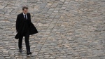 French President Emmanuel Macron walks back during a ceremony at the Invalides monument, Wednesday, Feb.7, 2024. (AP Photo/Thibault Camus, File)