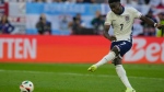 England's Bukayo Saka scores during the penalty shootout of a quarterfinal match between England and Switzerland at the Euro 2024 soccer tournament in Duesseldorf, Germany, Saturday, July 6, 2024. (AP Photo/Martin Meissner)