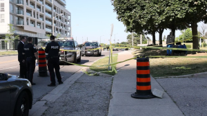 Toronto police can be seen on scene where a male victim was stabbed multiple times in a violent dispute. (Jacob Estrin / CP24) 