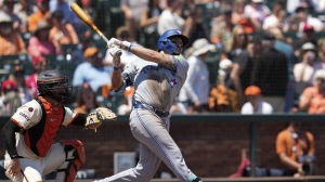 Toronto Blue Jays' Spencer Horwitz, right, watches his solo home run in front of San Francisco Giants catcher Patrick Bailey, left, during the fifth inning of a baseball game Thursday, July 11, 2024, in San Francisco. (AP Photo/Godofredo A. Vásquez)
